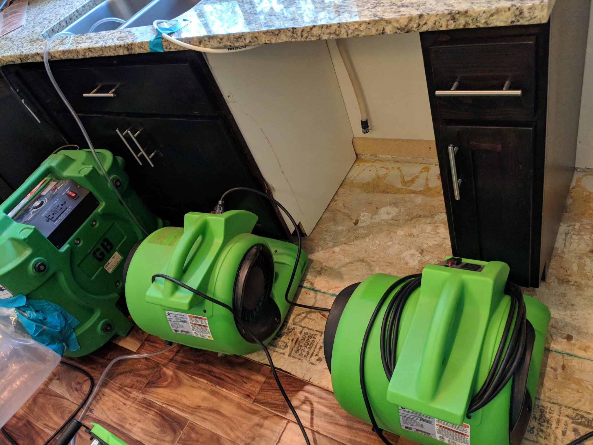 Master Restoration dehumidifiers after dishwasher leak in kitchen