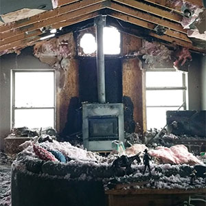 Burned out living room in boise that will need fire damage restoration services