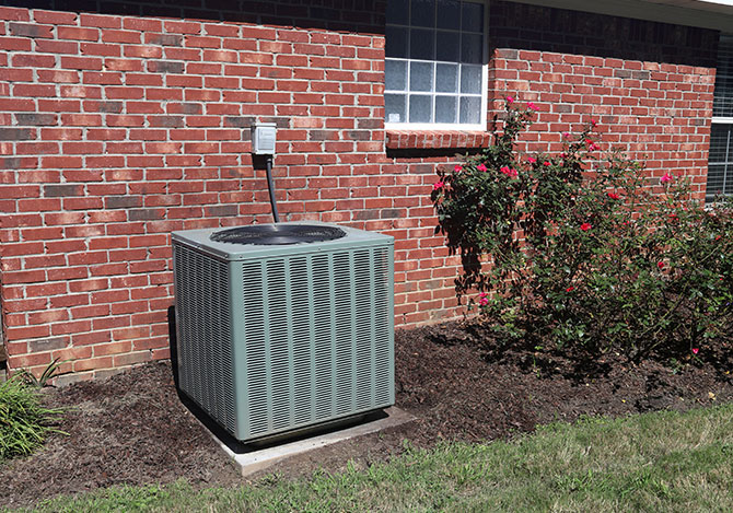 HVAC unit next to a brick house in Boise Idaho