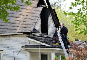 Fire inspector photographing house fire in Boise Idaho