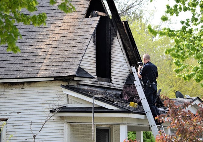 Fire inspector photographing house fire in Boise Idaho