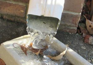 water frozen in a home down spout