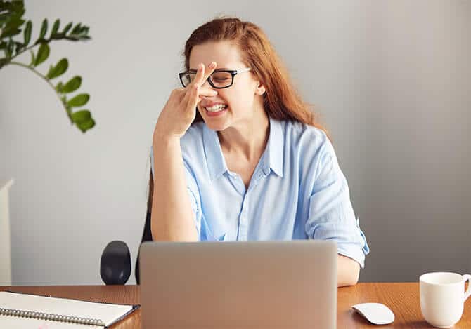 Woman pinching nose because of musty order